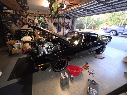 Vehicle positioned in a home workshop