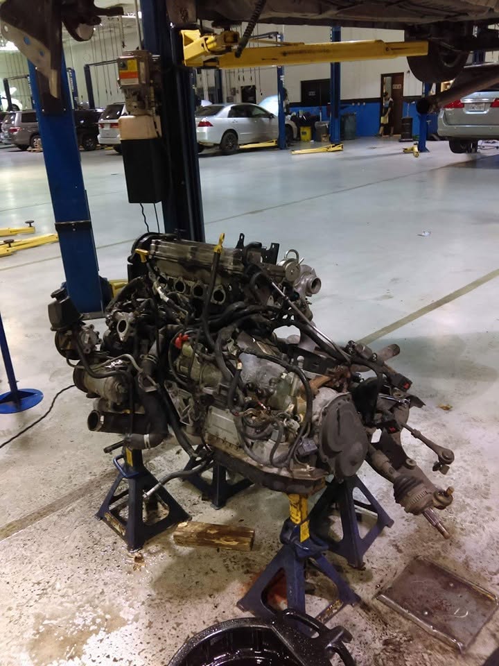Removed engine assembly in a workshop